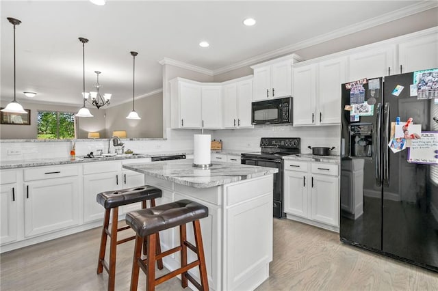 286 Blue Pointe Ct, Suwanee, GA 30024 - kitchen featuring black appliances, a sink, light wood-type flooring, decorative backsplash, and recessed lighting