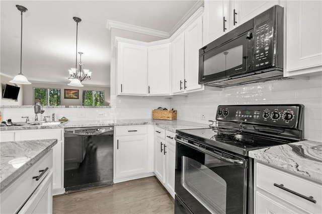 286 Blue Pointe Ct, Suwanee, GA 30024 - kitchen with black appliances, a sink, tasteful backsplash, white cabinetry, and ornamental molding