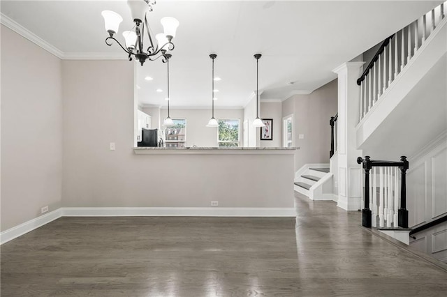 286 Blue Pointe Ct, Suwanee, GA 30024 - unfurnished living room with stairs, baseboards, dark wood-type flooring, a chandelier, and crown molding