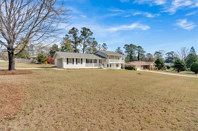 view of front facade with a garage and a front lawn