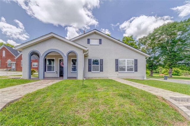 1 Elm St, Aragon, GA 30104 - view of front of house featuring brick siding, a front lawn, and a porch