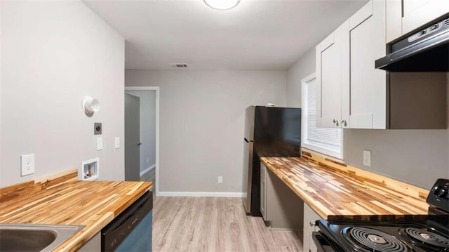 kitchen with dishwashing machine, butcher block countertops, black range with electric cooktop, and white cabinetry