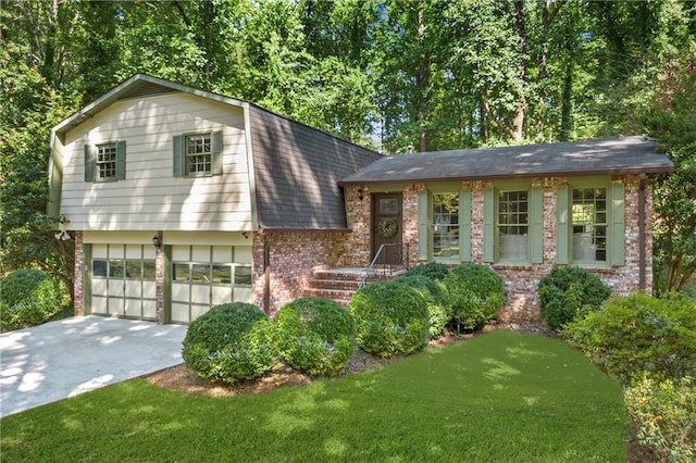 tri-level home featuring a front yard and a garage