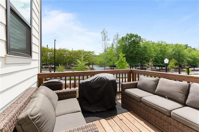 300 Olmstead Way, Alpharetta, GA 30022 - wooden deck with outdoor lounge area, a water view, and area for grilling