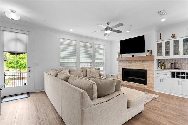 300 Olmstead Way, Alpharetta, GA 30022 - living area with ceiling fan, light wood finished floors, ornamental molding, a fireplace, and recessed lighting