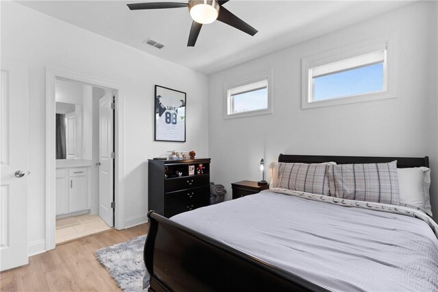 300 Olmstead Way, Alpharetta, GA 30022 - bedroom with light wood finished floors, ensuite bath, and a ceiling fan
