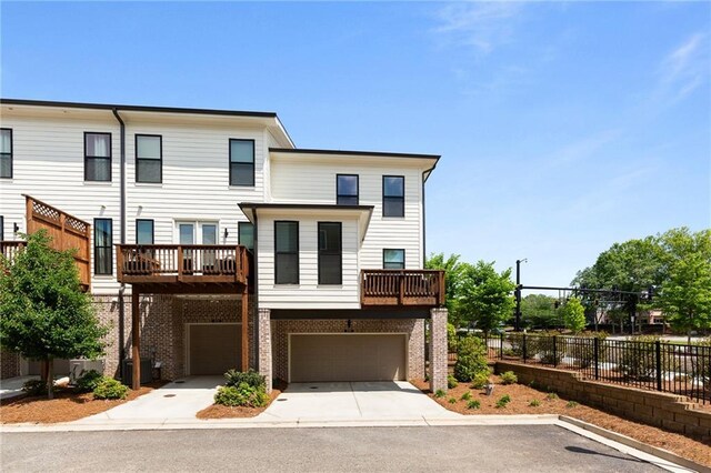 300 Olmstead Way, Alpharetta, GA 30022 - view of front facade featuring fence, a garage, driveway, central AC unit, and a balcony