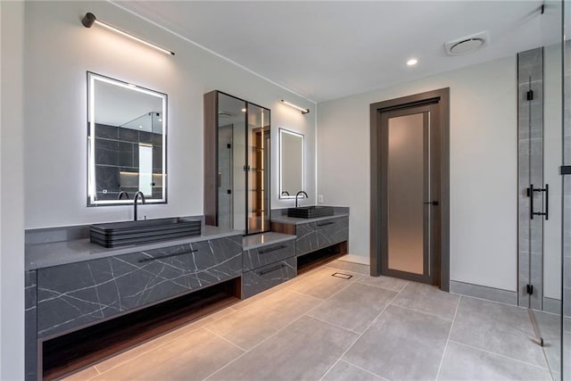 bathroom featuring vanity, tile patterned flooring, and a shower stall