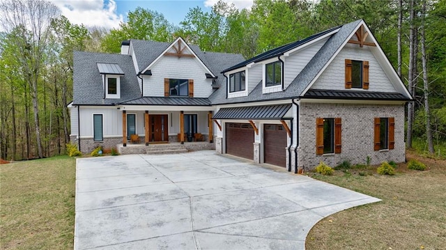 view of front of property with a porch, an attached garage, a front yard, and concrete driveway