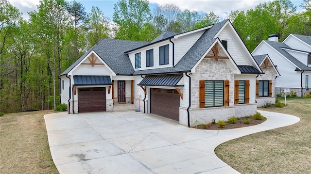 view of front of home featuring a standing seam roof, board and batten siding, a shingled roof, and stone siding