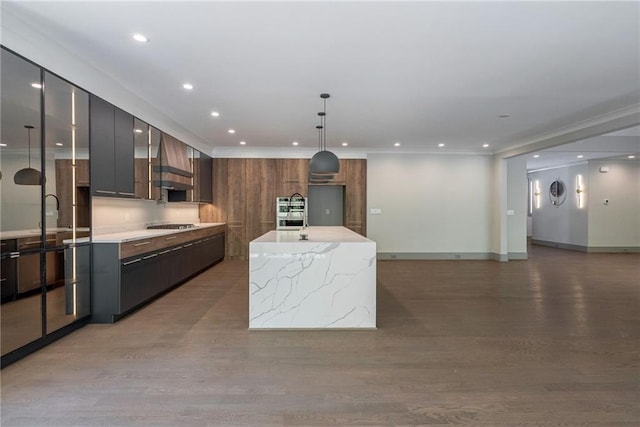 kitchen featuring recessed lighting, ornamental molding, modern cabinets, and light wood finished floors