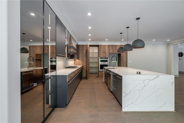kitchen featuring light wood-style floors, appliances with stainless steel finishes, modern cabinets, and recessed lighting