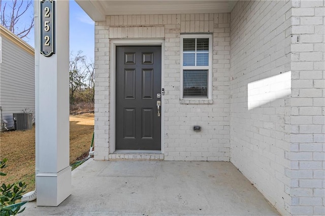 property entrance with central AC unit