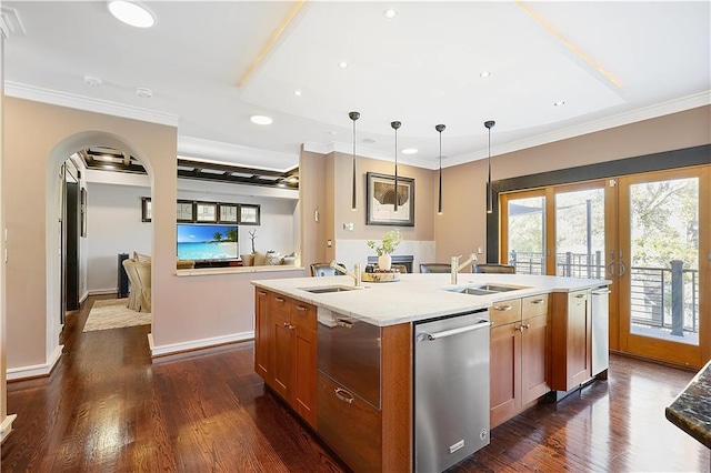 kitchen with dishwasher, decorative light fixtures, dark wood-type flooring, and an island with sink