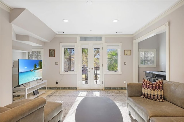 living room with french doors and ornamental molding