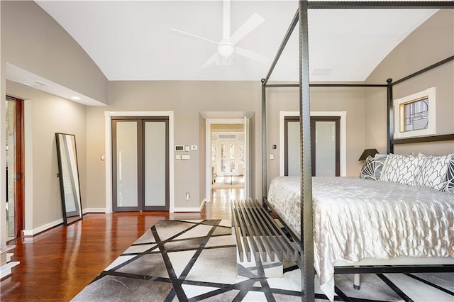 bedroom with hardwood / wood-style floors, ceiling fan, and vaulted ceiling