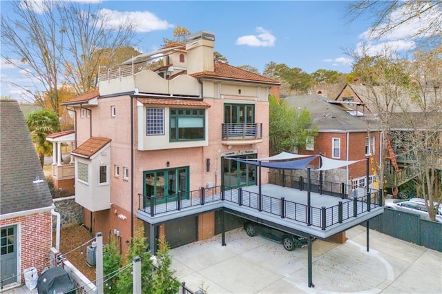 back of house with a garage