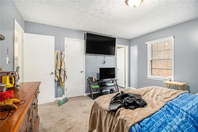 carpeted bedroom featuring a textured ceiling