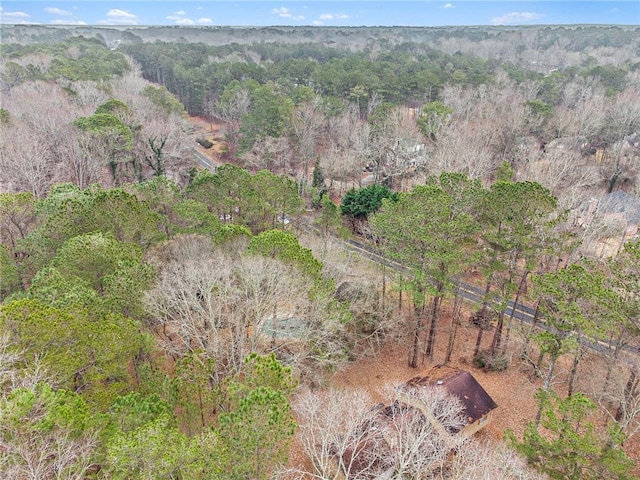 drone / aerial view featuring a view of trees