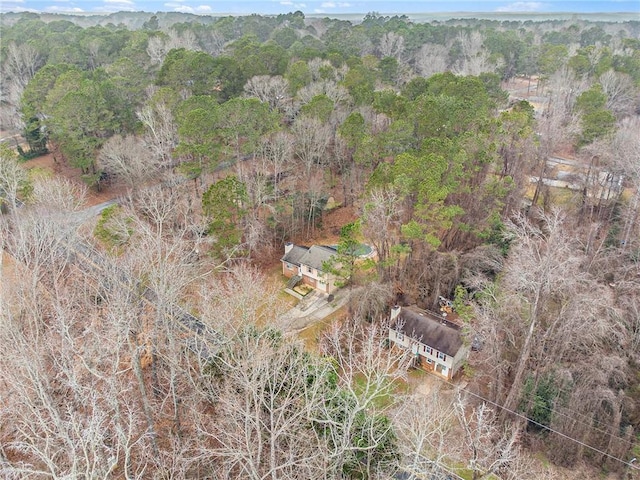 birds eye view of property with a forest view