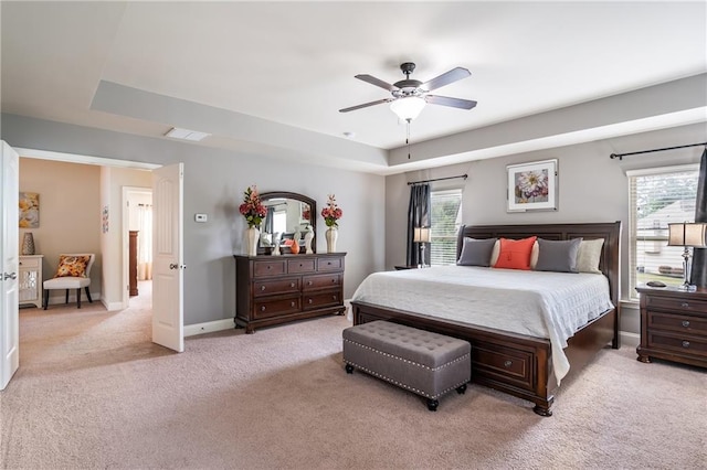 4305 Hunters Walk Way, Cumming, GA 30028 - bedroom with light colored carpet, baseboards, a ceiling fan, and a raised ceiling