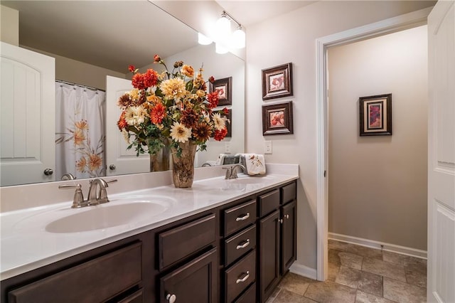 4305 Hunters Walk Way, Cumming, GA 30028 - full bath with double vanity, baseboards, and stone finish flooring