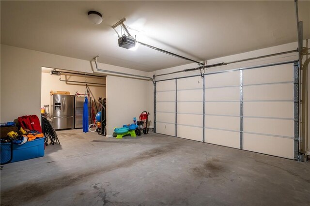 4305 Hunters Walk Way, Cumming, GA 30028 - garage featuring stainless steel fridge and a garage door opener