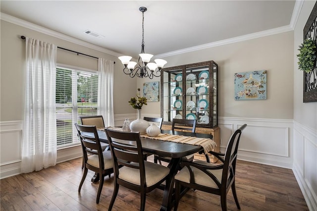 4305 Hunters Walk Way, Cumming, GA 30028 - dining room with a chandelier, ornamental molding, wainscoting, dark wood-style floors, and a decorative wall