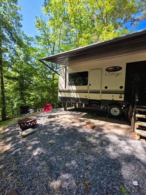 32 7th St, Ellijay, GA 30540 - view of parking / parking lot with an outdoor fire pit