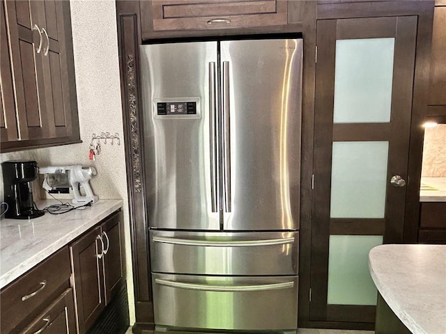 32 7th St, Ellijay, GA 30540 - kitchen with freestanding refrigerator and dark brown cabinetry