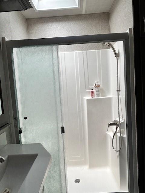 32 7th St, Ellijay, GA 30540 - full bathroom featuring a shower stall and a sink