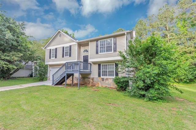 5290 Forest Downs Ln, Atlanta, GA 30349 - split foyer home featuring a front lawn, an attached garage, driveway, stairway, and stone siding