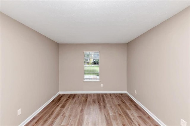 5290 Forest Downs Ln, Atlanta, GA 30349 - unfurnished room with light wood finished floors and baseboards