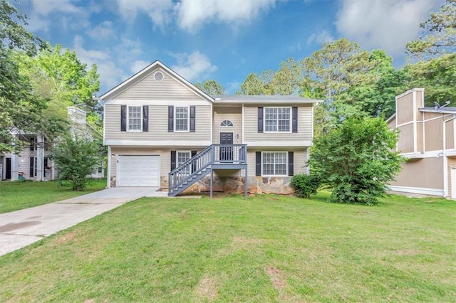 5290 Forest Downs Ln, Atlanta, GA 30349 - split foyer home featuring driveway, a front lawn, and an attached garage