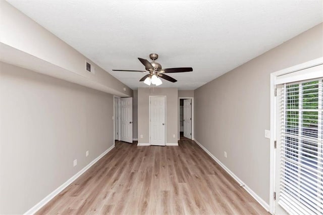 5290 Forest Downs Ln, Atlanta, GA 30349 - unfurnished bedroom featuring light wood-style floors, baseboards, and a ceiling fan