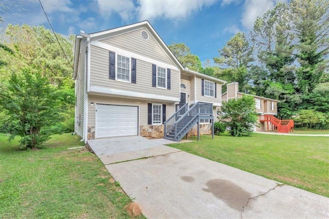 5290 Forest Downs Ln, Atlanta, GA 30349 - split foyer home featuring stairway, driveway, stone siding, an attached garage, and a front lawn