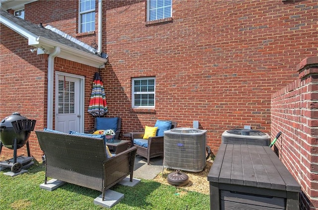 exterior space featuring an outdoor living space and central AC