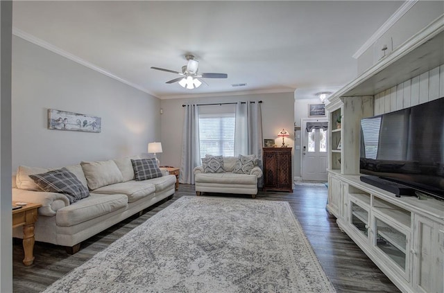 living room featuring crown molding, dark hardwood / wood-style floors, and ceiling fan