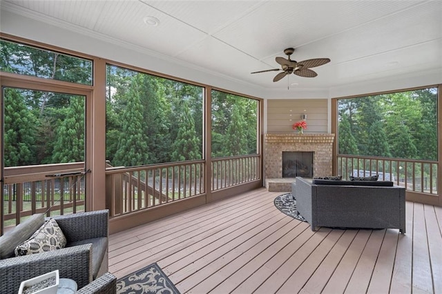 2385 Saddle Brook Trce, Cumming, GA 30040 - sunroom featuring ceiling fan, plenty of natural light, and an outdoor living space with a fireplace