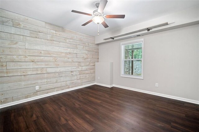 2385 Saddle Brook Trce, Cumming, GA 30040 - spare room featuring wood finished floors, ceiling fan, and baseboards