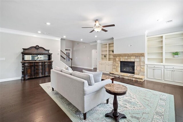 2385 Saddle Brook Trce, Cumming, GA 30040 - living area with a ceiling fan, baseboards, a fireplace, ornamental molding, and dark wood-type flooring