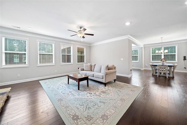 2385 Saddle Brook Trce, Cumming, GA 30040 - living room with a chandelier, crown molding, ceiling fan, baseboards, and dark wood-style flooring