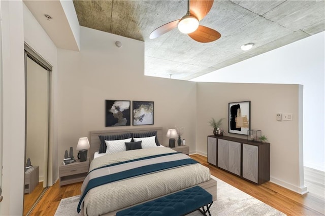 bedroom featuring ceiling fan and light hardwood / wood-style floors