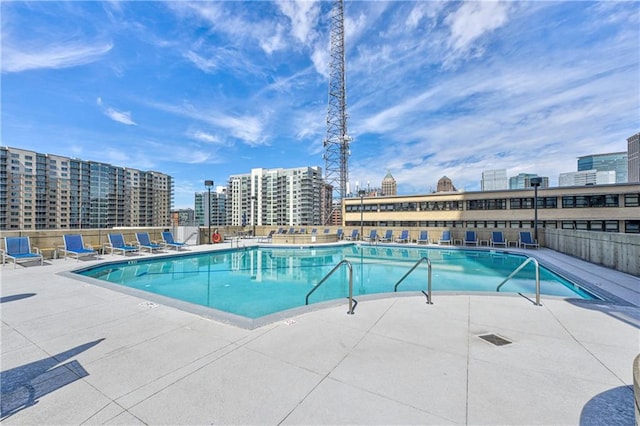 view of swimming pool featuring a patio area