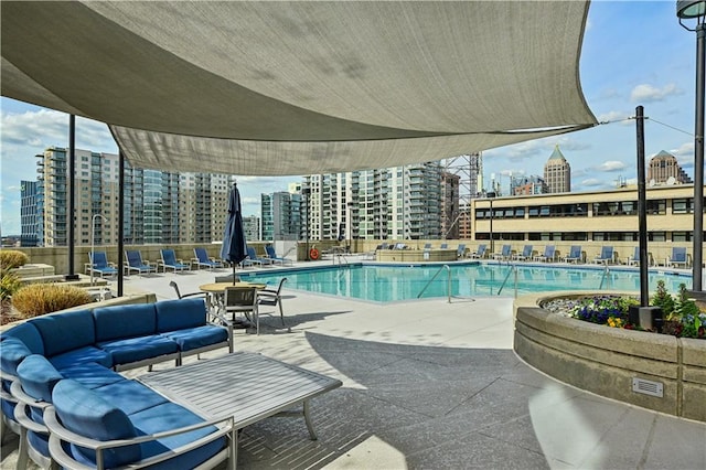 view of swimming pool featuring a patio