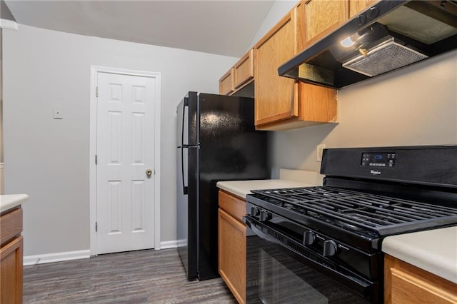 5069 Jonesboro Rd, Union City, GA 30291 - kitchen with black appliances, exhaust hood, dark wood finished floors, and light countertops