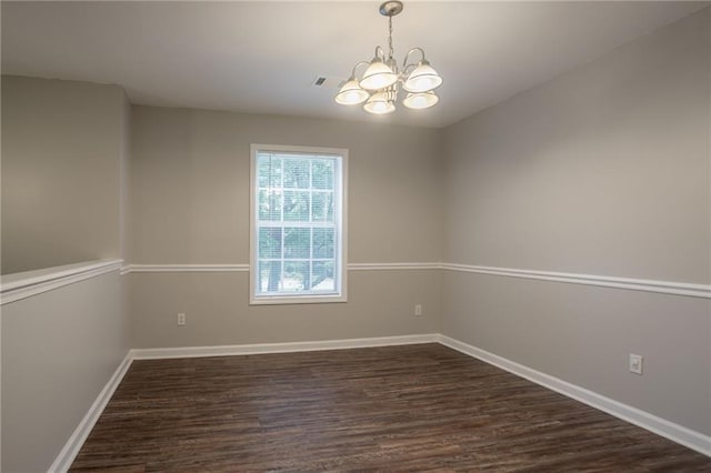 5069 Jonesboro Rd, Union City, GA 30291 - empty room featuring a chandelier and dark wood finished floors