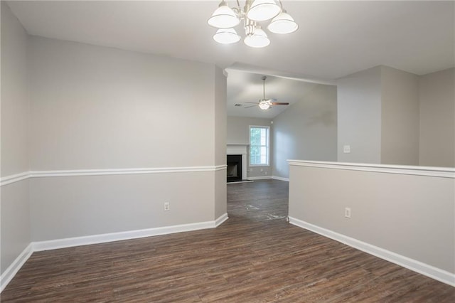 5069 Jonesboro Rd, Union City, GA 30291 - empty room with dark wood finished floors, ceiling fan, a chandelier, a fireplace, and lofted ceiling