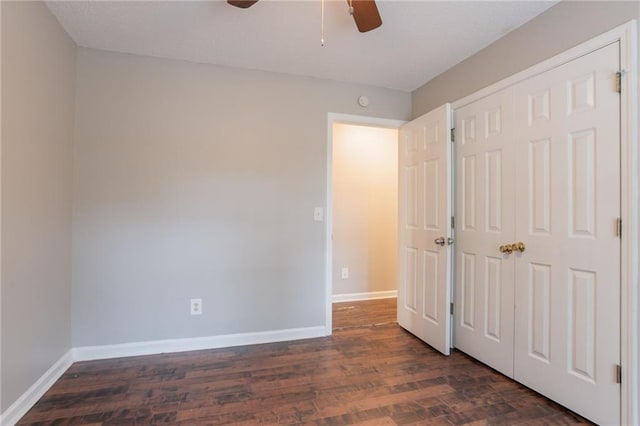 5069 Jonesboro Rd, Union City, GA 30291 - unfurnished bedroom with dark wood-style floors, a ceiling fan, and a closet