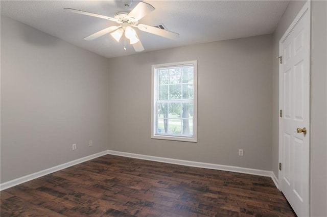 5069 Jonesboro Rd, Union City, GA 30291 - empty room with dark wood-type flooring and a ceiling fan